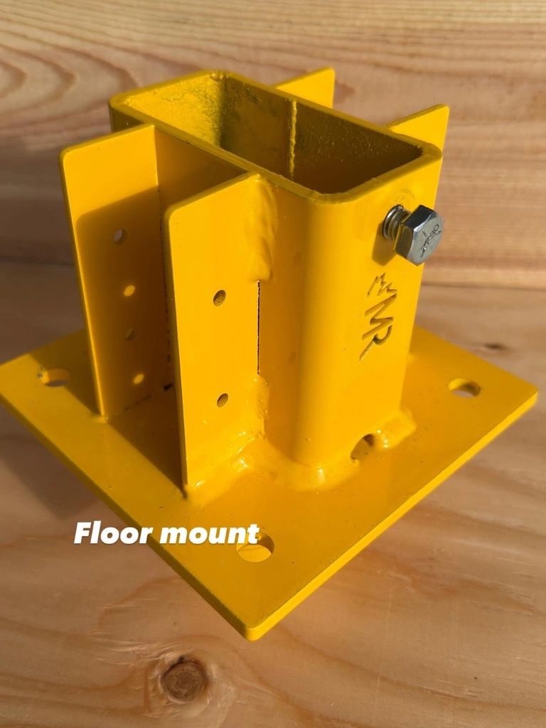 Floor mount yellow steel bracket construction